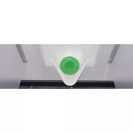 Vidám, édes illatok férfi mosdójában a G-PLUS-MELON piszoár rács segítségével.
